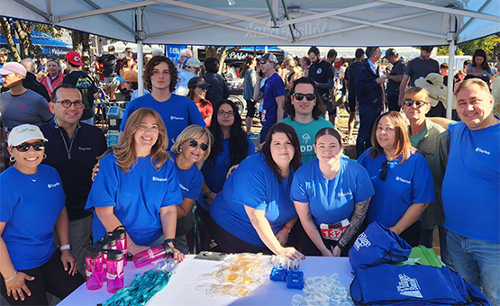 Group of Village Bankers in blue shirts.