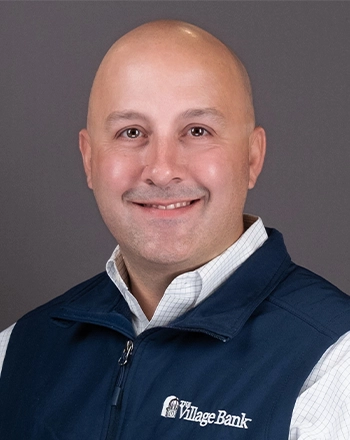 Pictured is the headshot of John Karacalidis.
