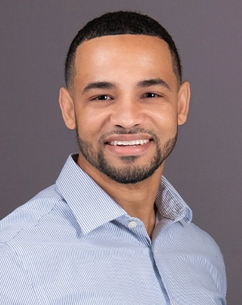 Pictured is the headshot of Juan Carlos Batista.