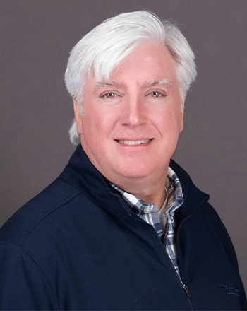 Pictured is the headshot of Mike Harrington.