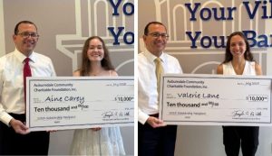 2025 Scholarship winners with big checks.
